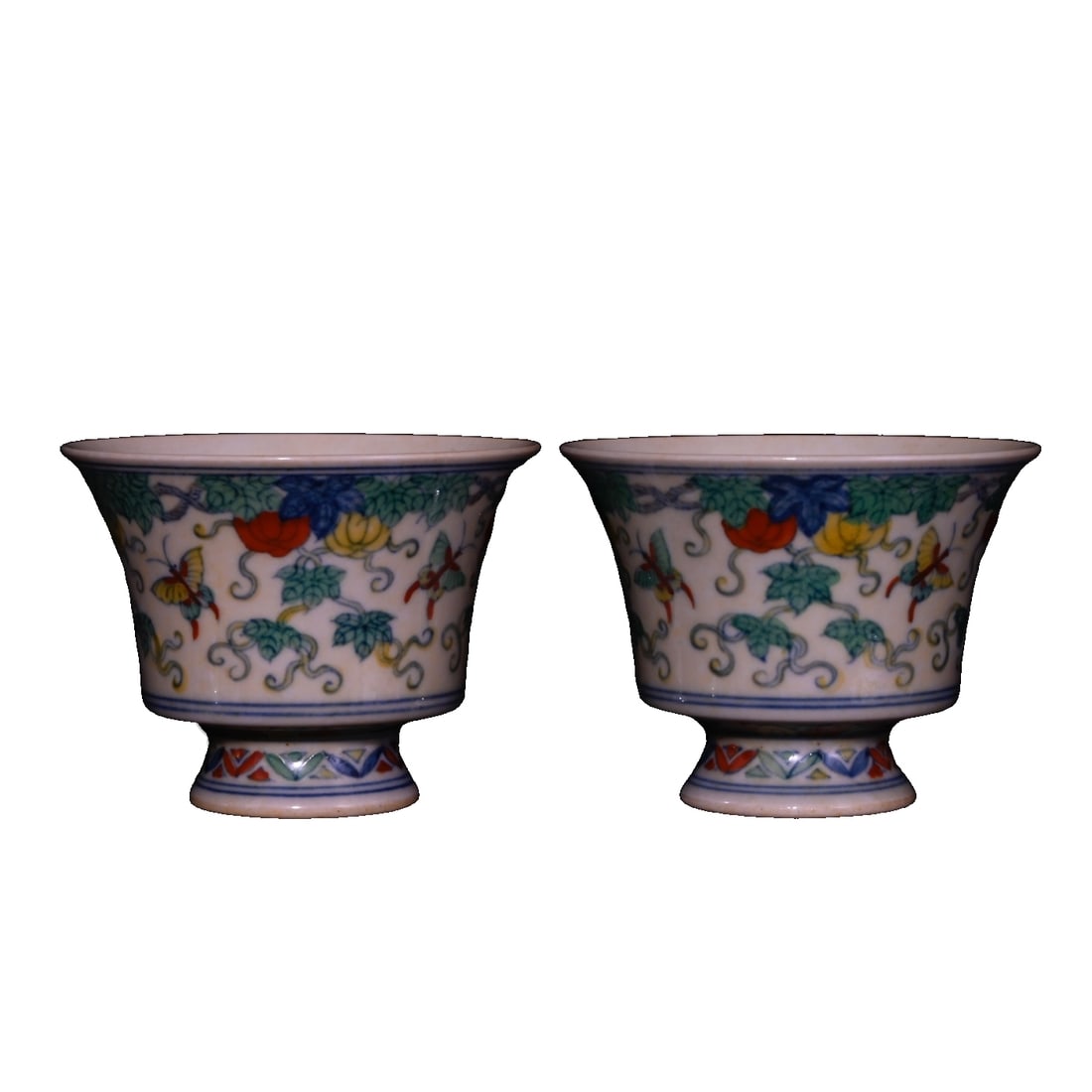 Ming Dynasty Chenghua Period Doucai Red Background Butterfly Pumpkin Pattern Goblet: Daming Chenghua period, painted polychrome red body with butterfly and pumpkin pattern high-footed cup, height 6.3×8.3 cm Freight: 1.International Shipping: Foreign shipping costs are determined by