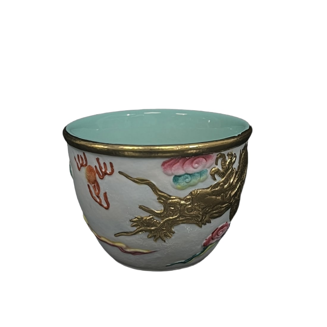 Qing Dynasty Qianlong Period Carved Porcelain Cup with Stacked Gold Dragon Playing with Pearl and: This Qing dynasty Qianlong period porcelain wine cup, 6.5 centimeters tall with a mouth diameter of 8.5 centimeters, is delicately adorned with gold-embellished dragon and pearl play and auspicious cl
