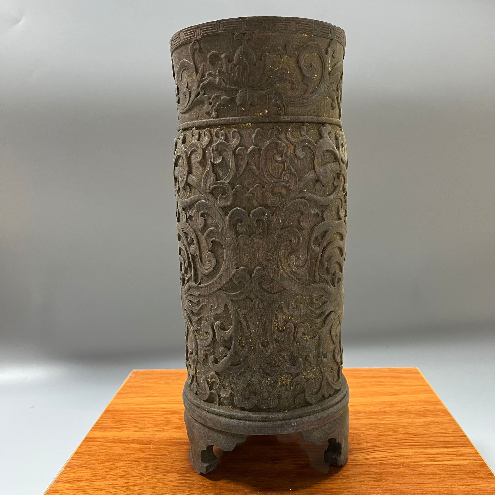 A three-legged brush pot with relief carving of dragons amidst lotus scrolls, dating from the (1 of 6)