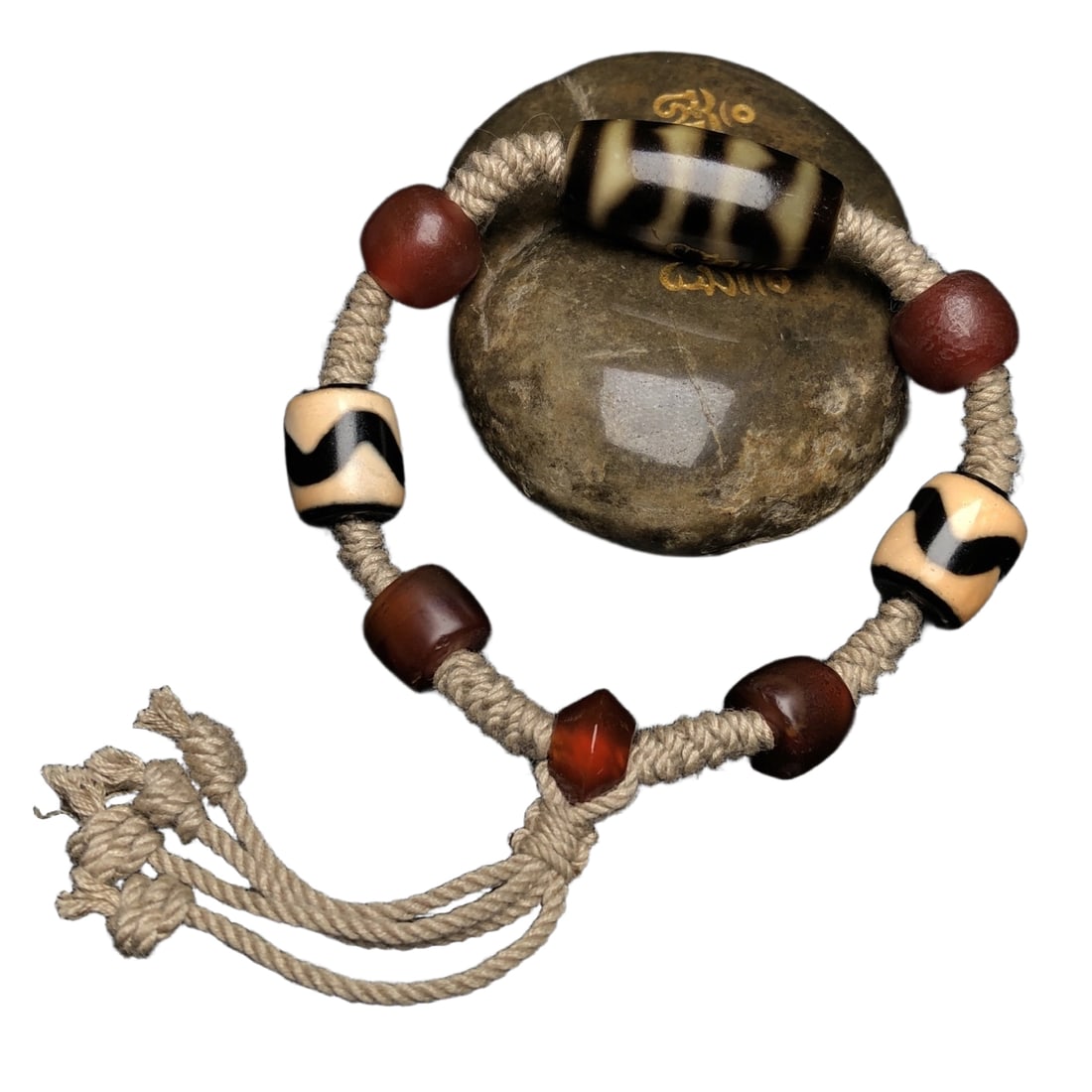 Tiger tooth celestial bead paired with carefully crafted red agate necklace. (1 of 10)