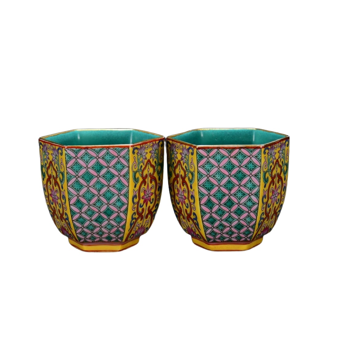 Qing Dynasty Yongzheng period cloisonné enamel floral pattern hexagonal cup with money design: This pair of Qing Yongzheng Falangcai hexagonal cups with floral and money pattern, measures 6.5 cm in height and 7 cm in diameter. The shape of the cups is elegant and symmetrical, with a clear