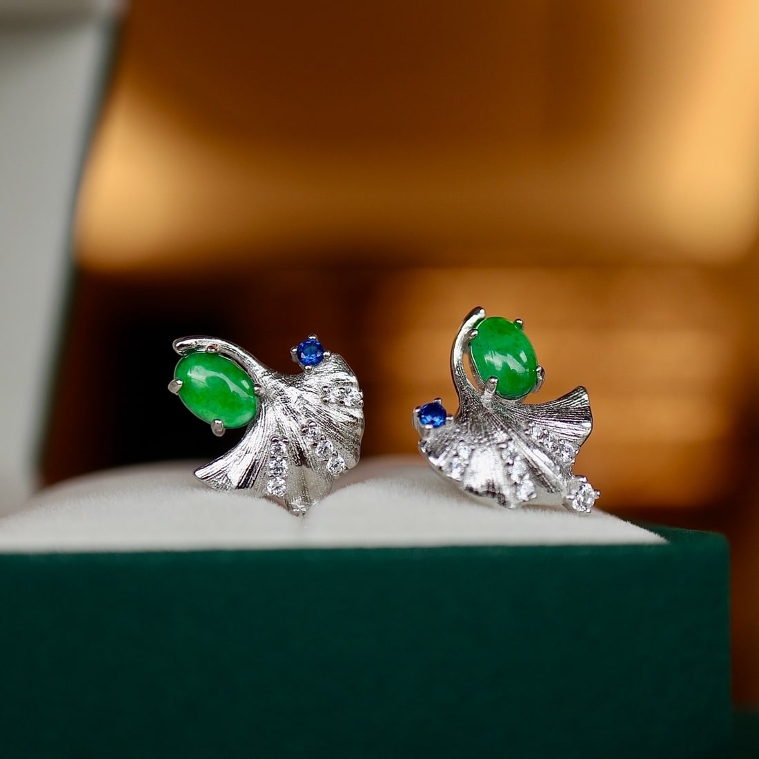 Natural jadeite Ginkgo Leaf Earrings: These earrings are inspired by the design of ginkgo leaves, exquisitely set in S925 silver, showcasing the essence of nature. The center features a natural jadeite, oval-shaped, approximately 4x6mm, e