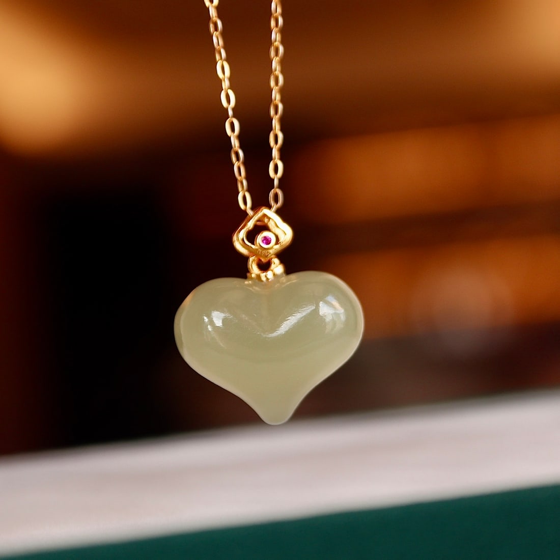 S925 silver natural Hetian jade pendant: This pendant showcases natural Hetian jade, carved into an exquisite peach-shaped design, approximately 16mm. The jade is delicate in quality, finely carved, emitting a soft luster that perfectly capt