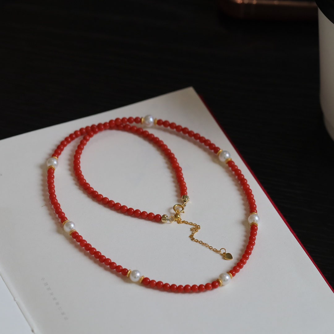 Natural red coral necklace and bracelet dual-use style: Natural red coral necklace and bracelet dual-use style, with pearls and 925 silver accessories, size 3.5mm, wraps around the wrist three times.