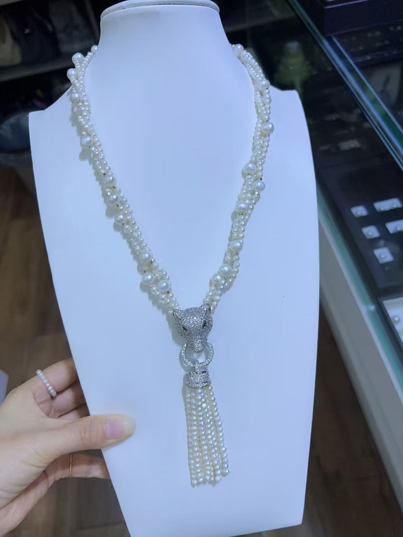 Natural white pearl necklace: This natural pearl necklace is a symbol of classic beauty and elegance. The multi-layer design adds a sense of luxury, making it a perfect accessory for both casual and formal occasions. The pearls