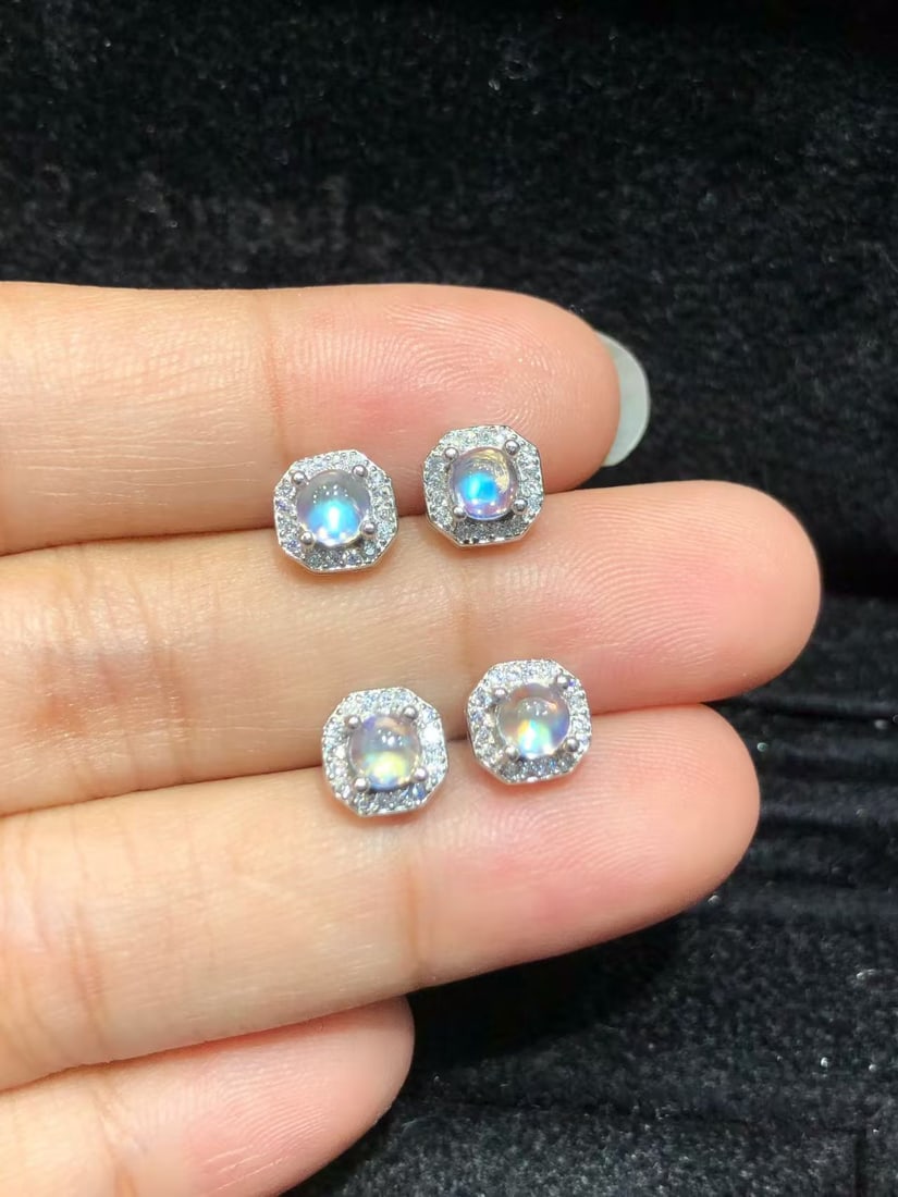 S925 pure silver natural moonstone earrings: These earrings showcase the captivating charm of natural moonstone, each carefully set in s925 sterling silver. The 4mm size of the moonstone displays a mysterious play of light and shadow, reminiscen