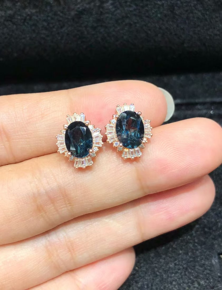 925 sterling silver natural topaz stud earrings: These earrings showcase the captivating beauty of natural topaz, intricately set in heavy silver S925 sterling silver. The deep blue hue of the topaz evokes thoughts of the depths of the ocean, provid