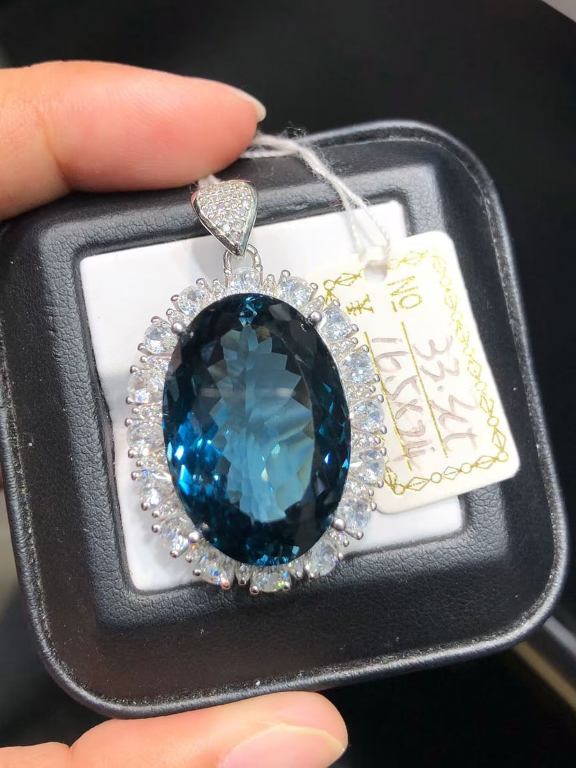925 sterling silver natural topaz pendant: This exquisite pendant showcases a stunning natural topaz stone with a mesmerizing deep blue color. The 33.3-carat main stone is meticulously set in high-quality S925 sterling silver, perfectly highli