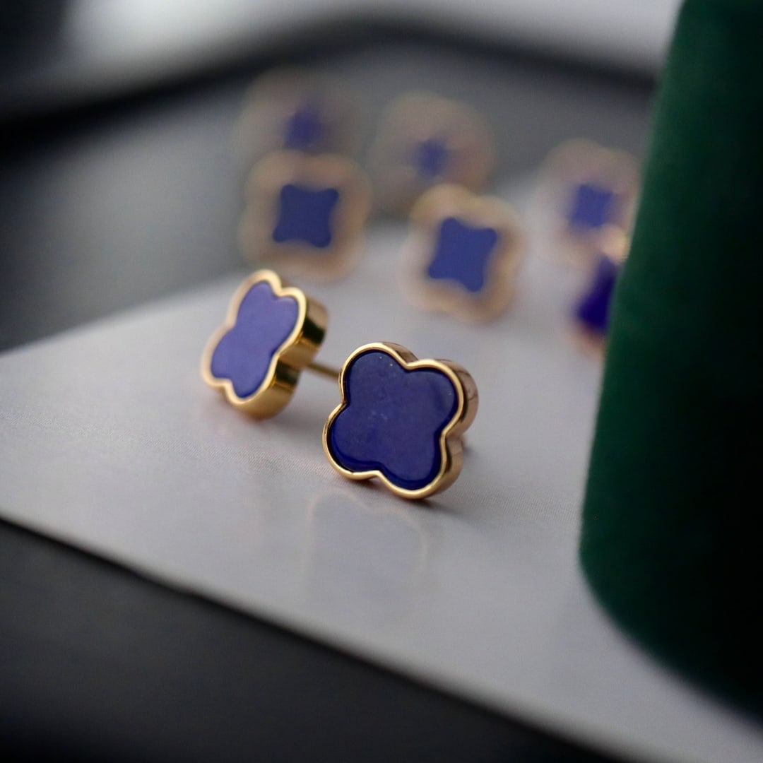 925 Sterling Silver with Natural Lapis Lazuli Earrings: These earrings showcase the captivating beauty of natural lapis lazuli, meticulously crafted into an exquisite four-leaf clover design. The deep blue hue and lustrous texture of the high-quality lapis