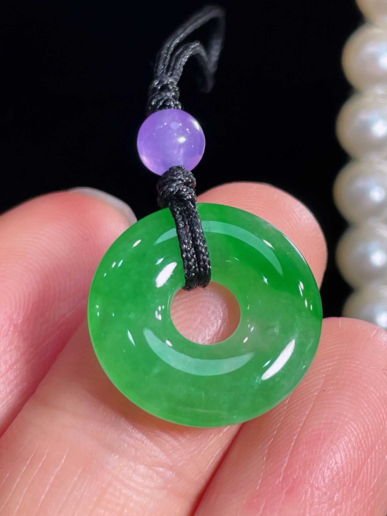 Natural jadeite Pendant: This exquisite pendant showcases a captivating natural jadeite known for its full green color and delicate water head. The naked stone measures 17.8x3.5x3.6mm.