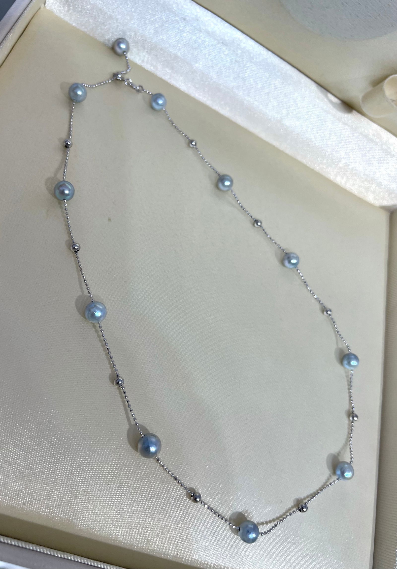 S925 Sterling Silver Pearl Necklace with a Gemstone Sheen: This necklace is a stunning piece that captures the ethereal beauty of natural South Sea pearls. It features 11 natural colored South Sea pearls, each nearly round, complemented by the simple