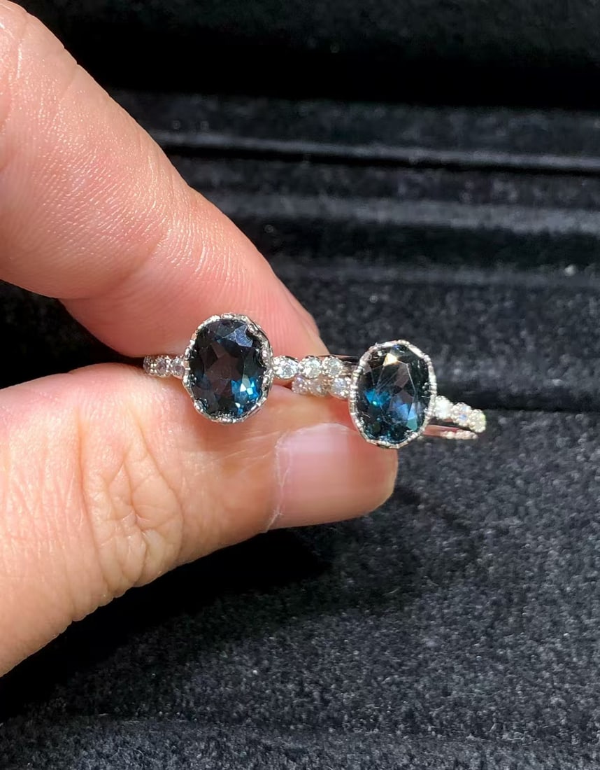 Blue topaz ring: This ring features a natural blue topaz as the main stone, showcasing a deep and enchanting blue color, reminiscent of the mysterious and elegant night sky. Each topaz is carefully selected and set