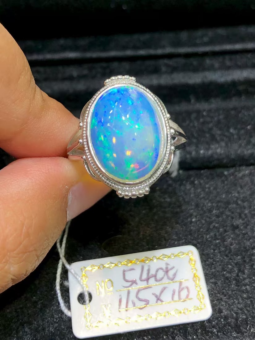 925 sterling silver opal ring: This Opal ring showcases the natural and colorful beauty, as if condensing the essence of nature at your fingertips. Its main stone is meticulously set, emitting a charming brilliance that perfectly e