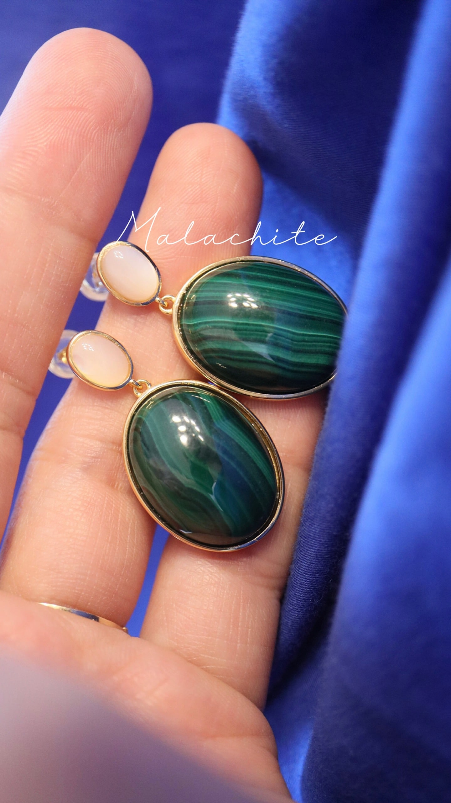 Peacock stone earrings: This peacock stone earring stud, with its simple yet elegant design, perfectly showcases the wearer's grace and taste. The deep color of the peacock stone combined with the minimalist style makes it a