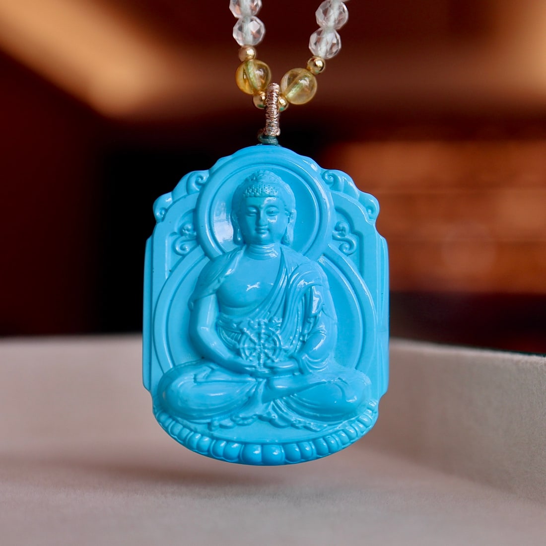 Turquoise Medicine Buddha Necklace: This turquoise necklace is renowned for its high transparency and royal blue color, showcasing a full and three-dimensional carving art. Each piece of turquoise is carefully selected to ensure its