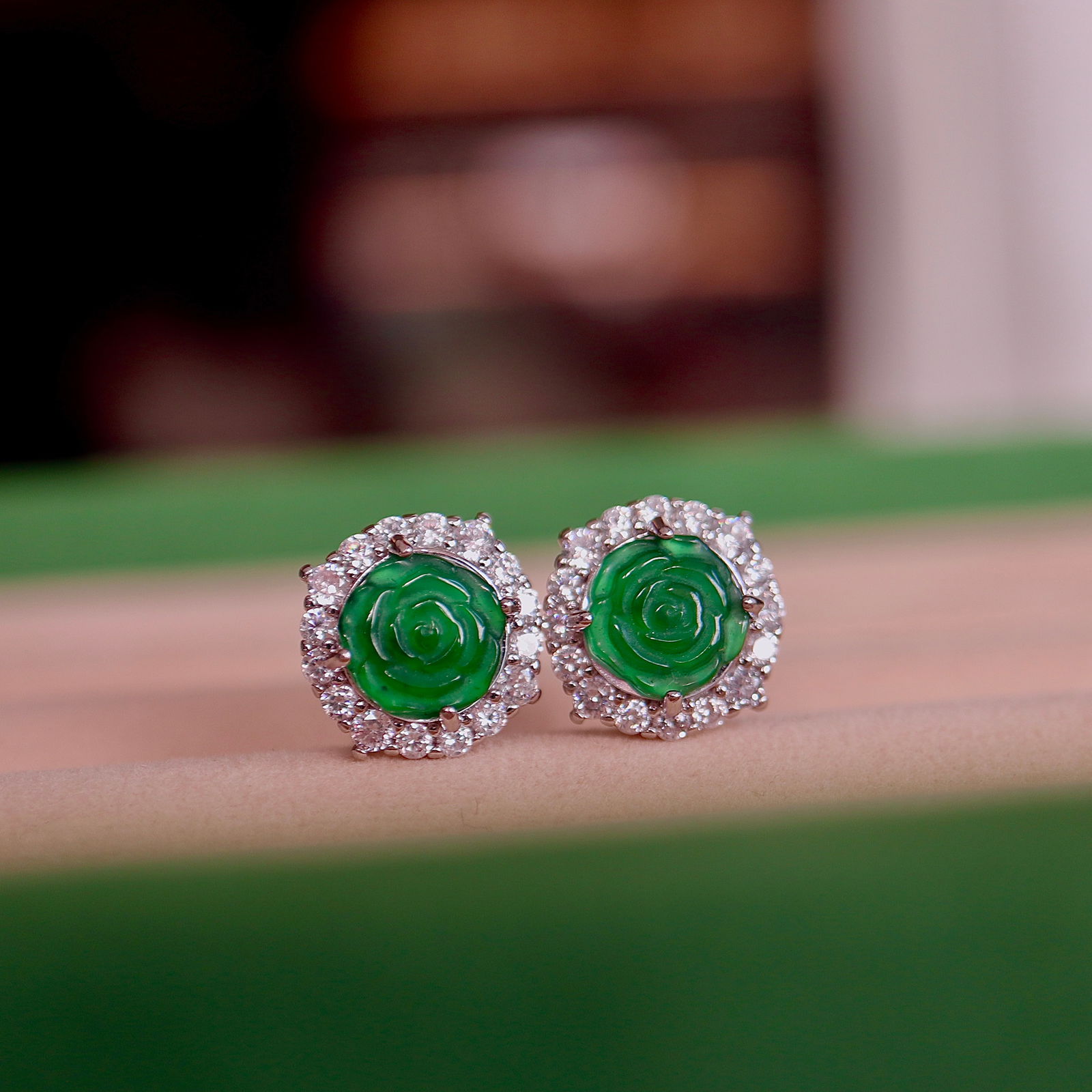 Jade rose stud earrings: These earrings are crafted from finely carved natural Type A jadeite, showcasing a captivating shade of positive green, resembling a blooming rose, simple yet elegant. Each jadeite is carefully select