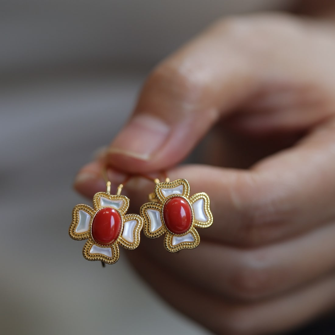 S925 silver plated red coral clover earrings: This red coral clover earrings have become a focal point in the fashion world due to its unique design and the charm of natural red coral. The clover-shaped earrings symbolize luck and happiness,