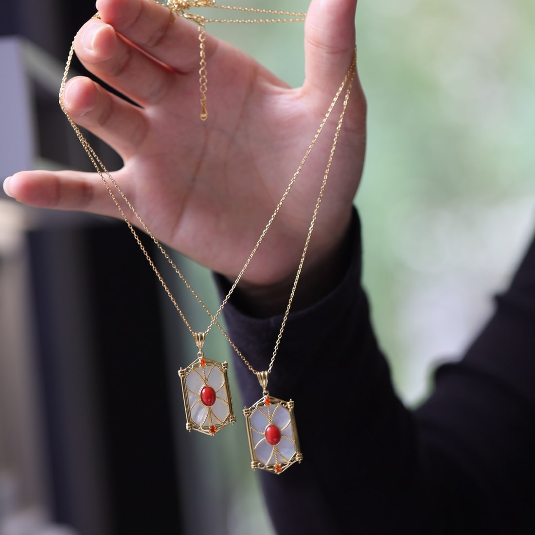 S925 silver inlaid with red coral pendant: This natural red coral pendant is inspired by the design of a flower window, showcasing elegant and exquisite craftsmanship. Its style is novel, exuding a strong retro feel, perfectly blending traditi