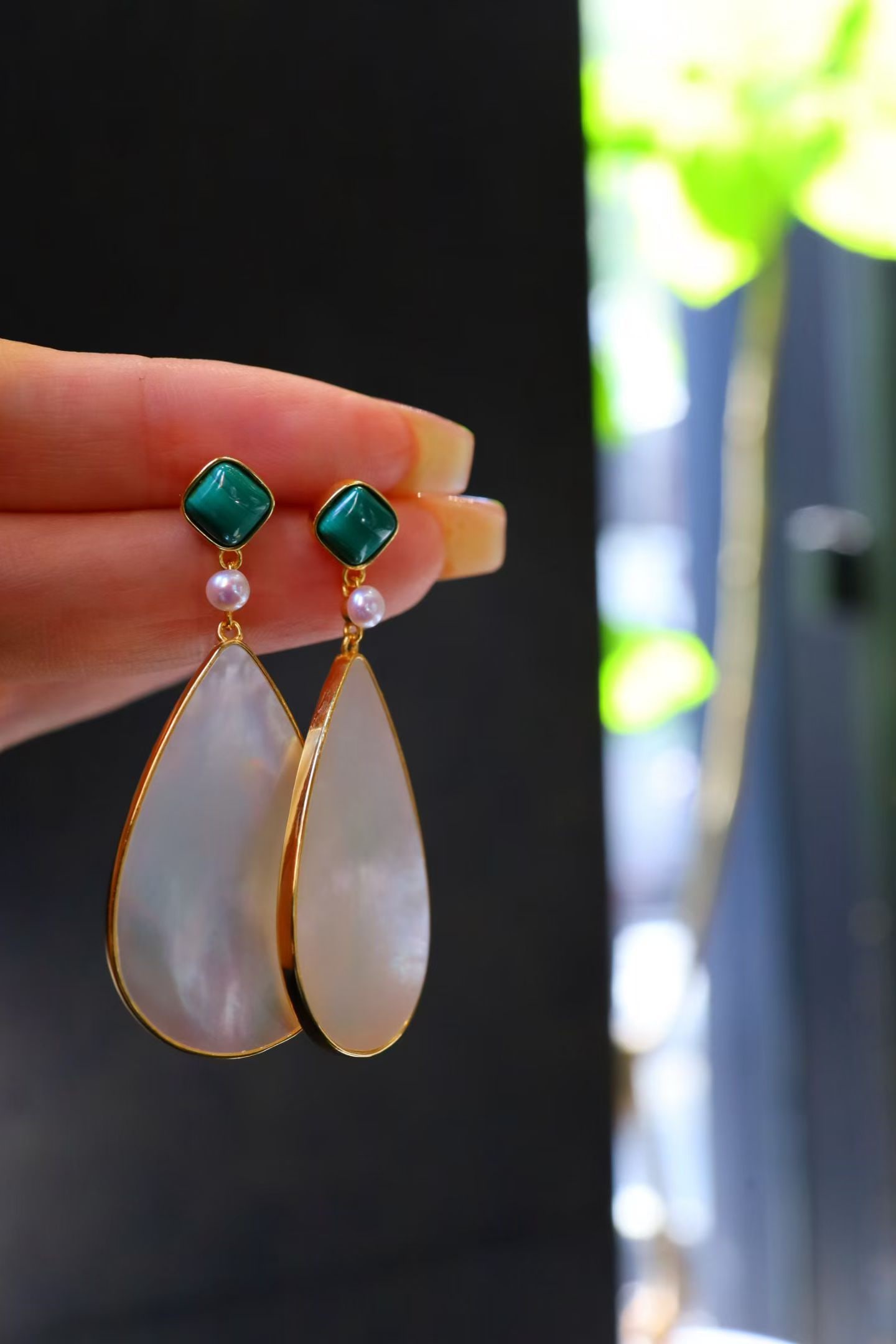 White mother of pearl peacock stone earrings: This earring is centered around a minimalist design, combining the soft luster of white mother-of-pearl with the unique color of peacock stone, showcasing a fresh yet elegant temperament. It is the