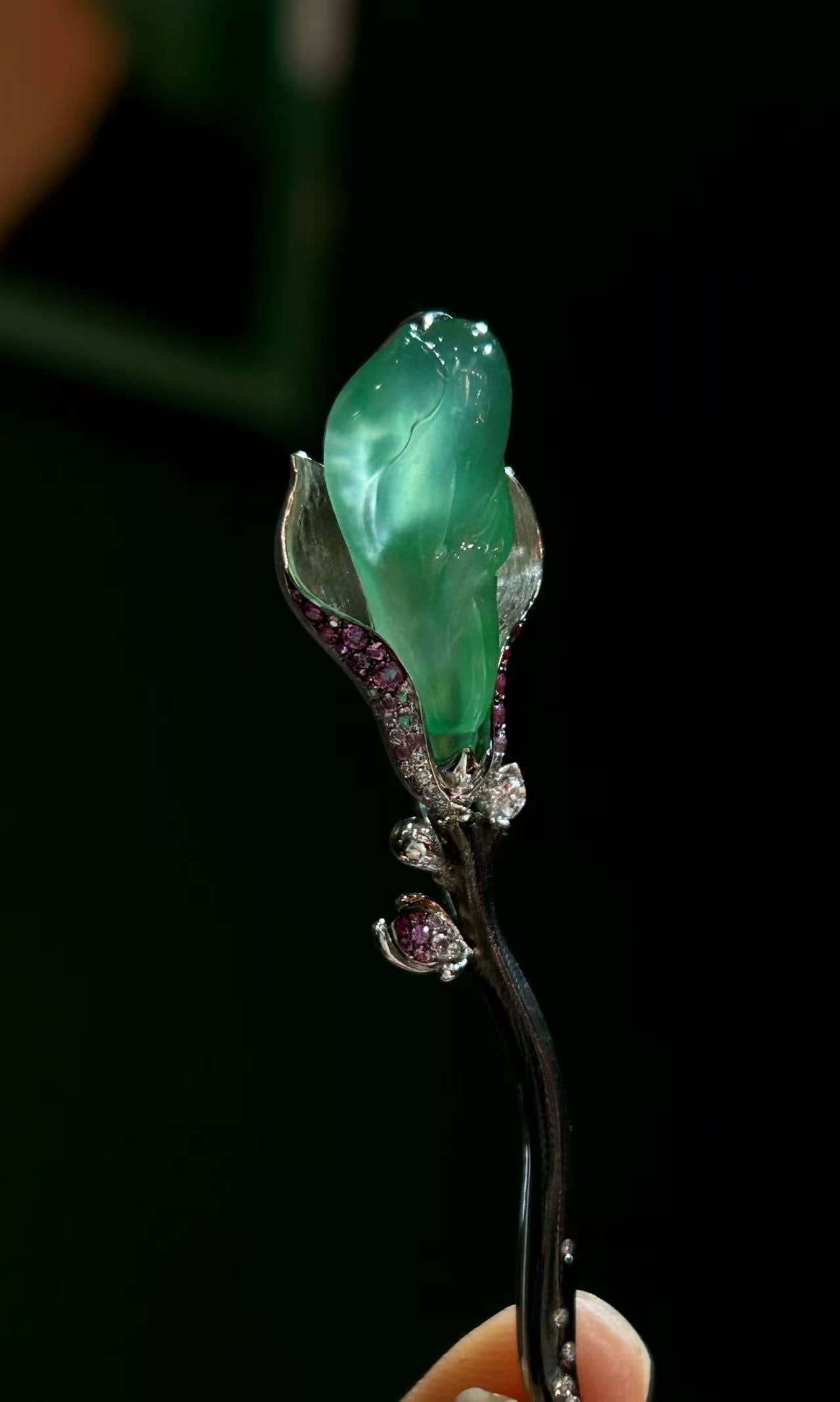 18K Gold Jadeite Jade Magnolia Brooch with Ruby Diamond Green Jade Fine Jewelry: This finely crafted brooch is inspired by the magnolia flower, combining natural jadeite jade with ruby and diamond accents, all set in 18K gold. The design reflects a balance of organic form and refi