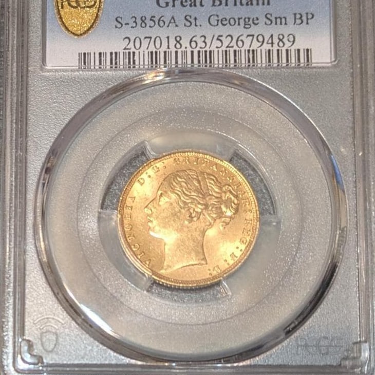 1871 Great Britain Queen Victoria Gold Sovereign – PCGS MS63 – St. George Reverse: An 1871 Great Britain Gold Sovereign issued during the reign of Queen Victoria, certified and slabbed by PCGS with a grade of MS63. This coin features the classic portrait of Queen Victoria on the