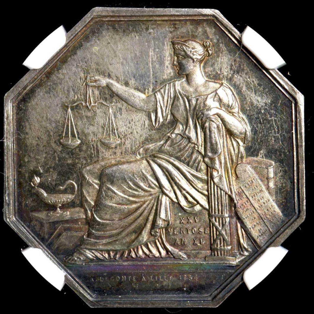 Ultra Rare Rainbow Toned NGC MS62 – France 1854 Notary Jeton: A beautifully preserved 1854 French silver jeton issued for the Notary Chamber of the BEthune district. The coin displays stunning rainbow toning with brilliant luster. Details Country: France Year: