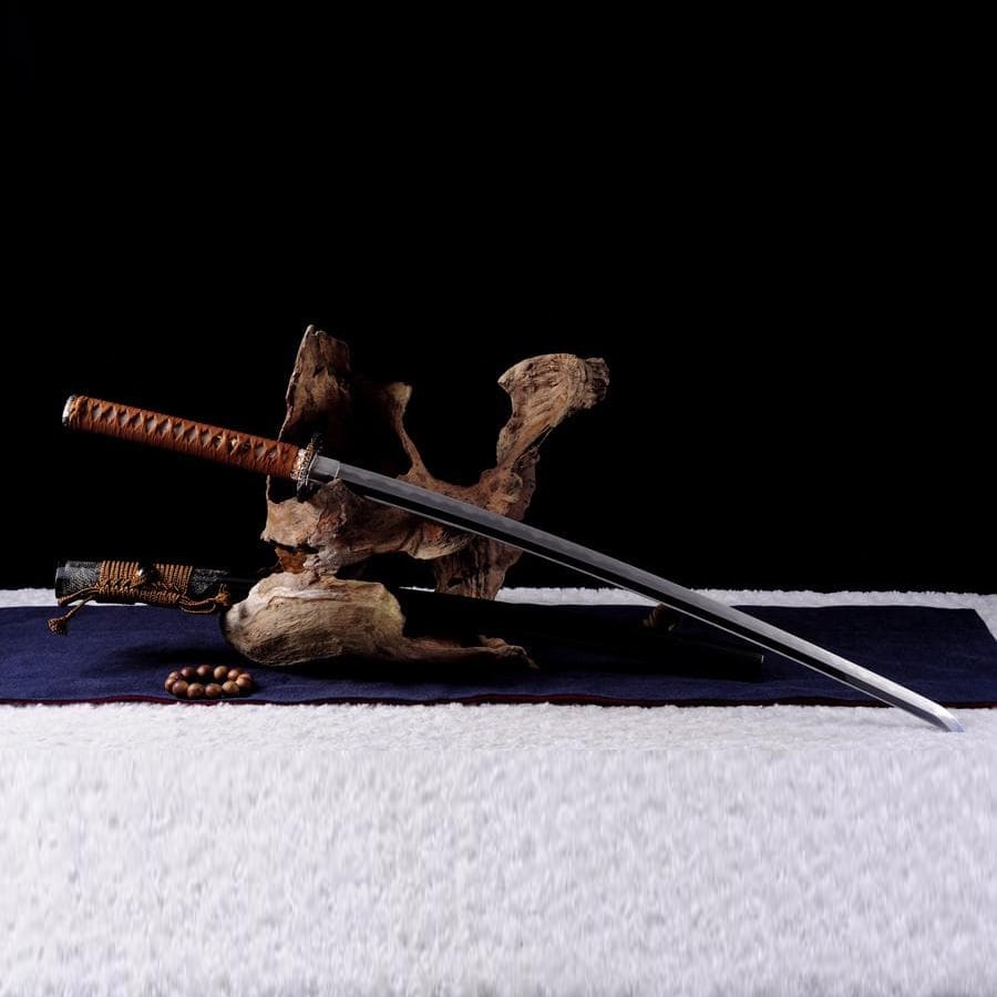 Kikuichi Sanmai-Awase Samurai Sword – Japanese Sword / Iaito (Decorative, Non-Sharp): Name: Kikuichi Sanmai-Awase Samurai Sword Item No.: 13273000 Specifications Overall Length: 103 cm Blade Length: 71 cm Tang Length: 26 cm Blade Width: 3.1 cm Blade Thickness: 0.7 cm Blade Material: