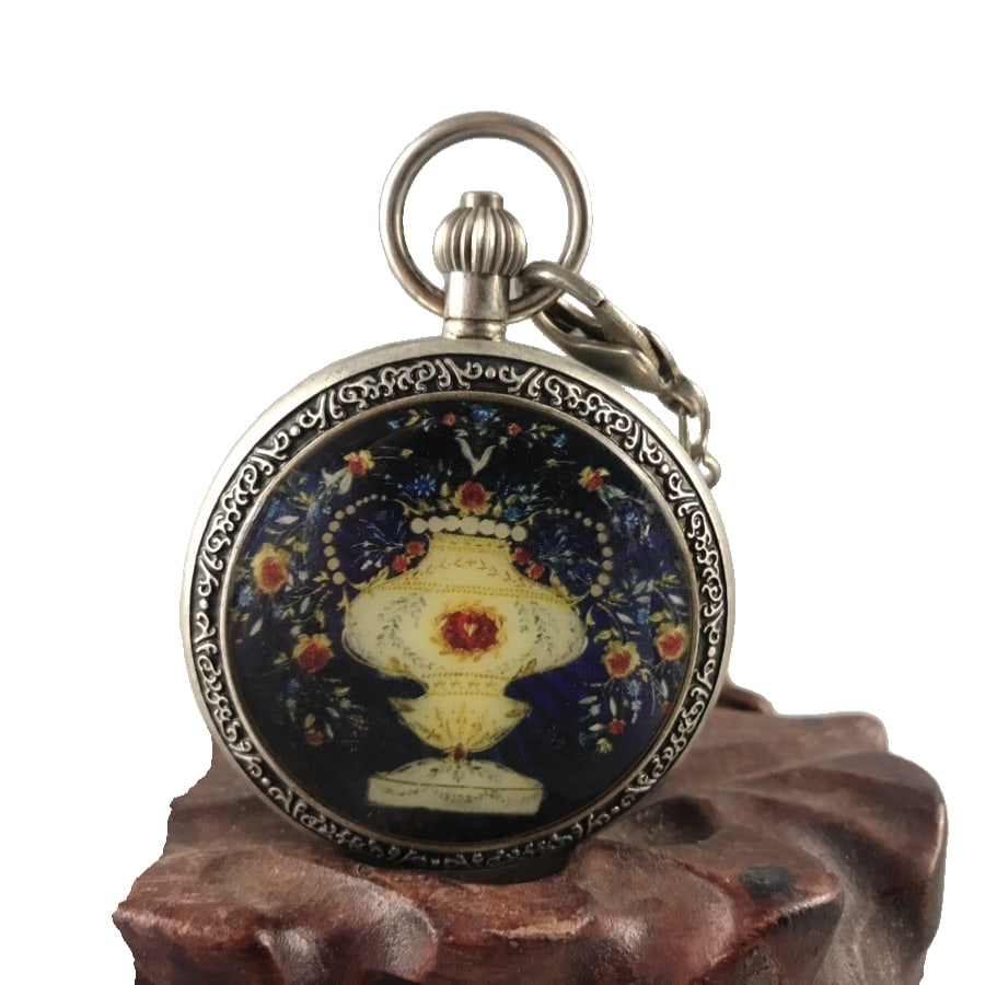 Silver double-cover mechanical pocket watch: Silver double-cover mechanical pocket watch, with a case size of 7.5x5.5cm and weighing 176 grams. The dial features Roman numerals, a silver case, and a blue enamel painted dial with exquisite