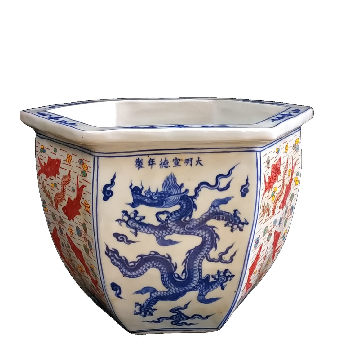 Ming Dynasty Xuande blue and white polychrome hand-painted dragon pattern hexagonal vase: This large Ming Xuande blue and white polychrome hand-painted hexagonal vase features dragon motifs. The shape of the vessel is square and stable, with all six sides displaying a dignified and