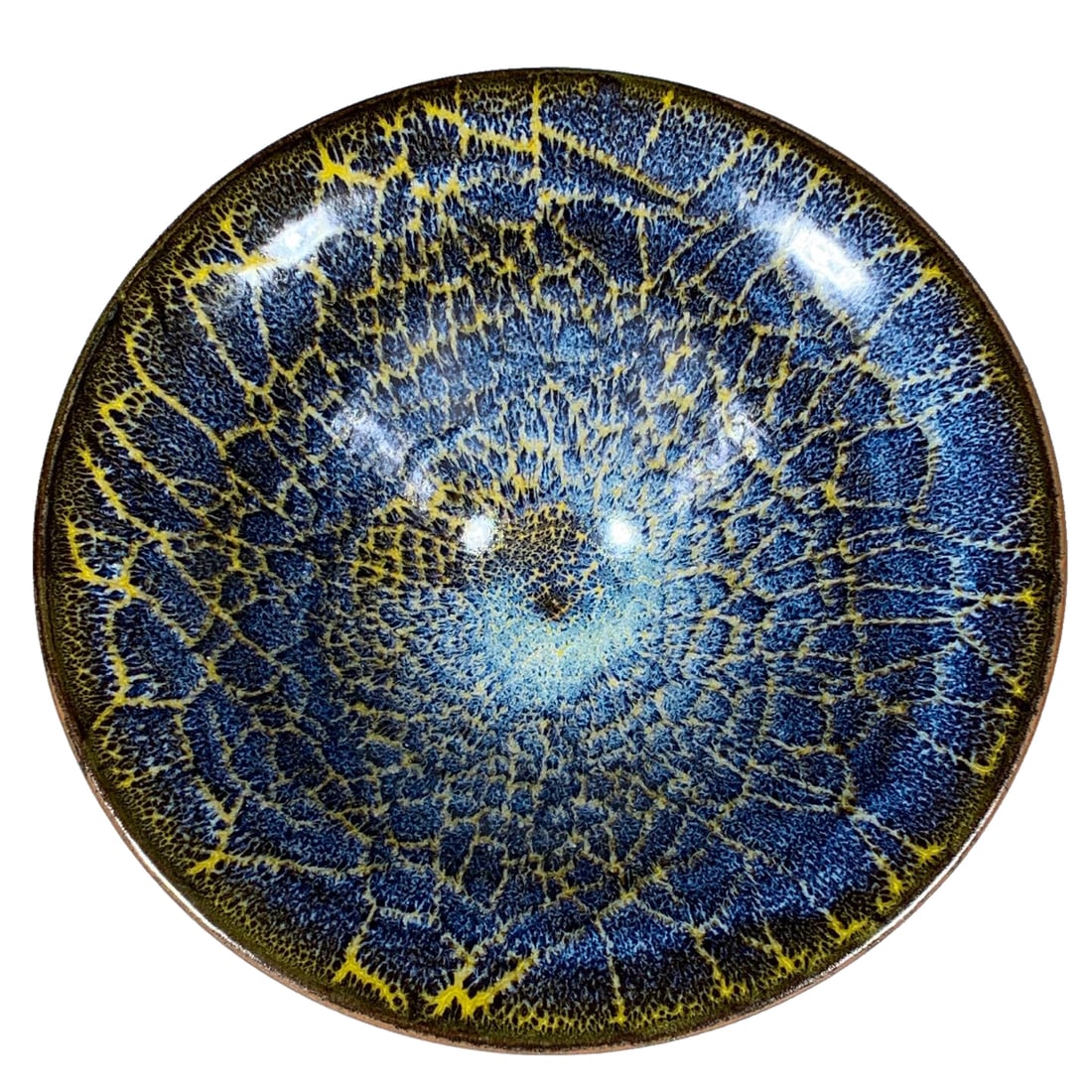 Song Jian kiln flambe glazed cup: This Song Dynasty Jian kiln variegated glazed cup stands 8 centimeters high with a diameter of 21.5 centimeters. The vessel has a dignified and full shape, with a thick and textured glaze layer. The