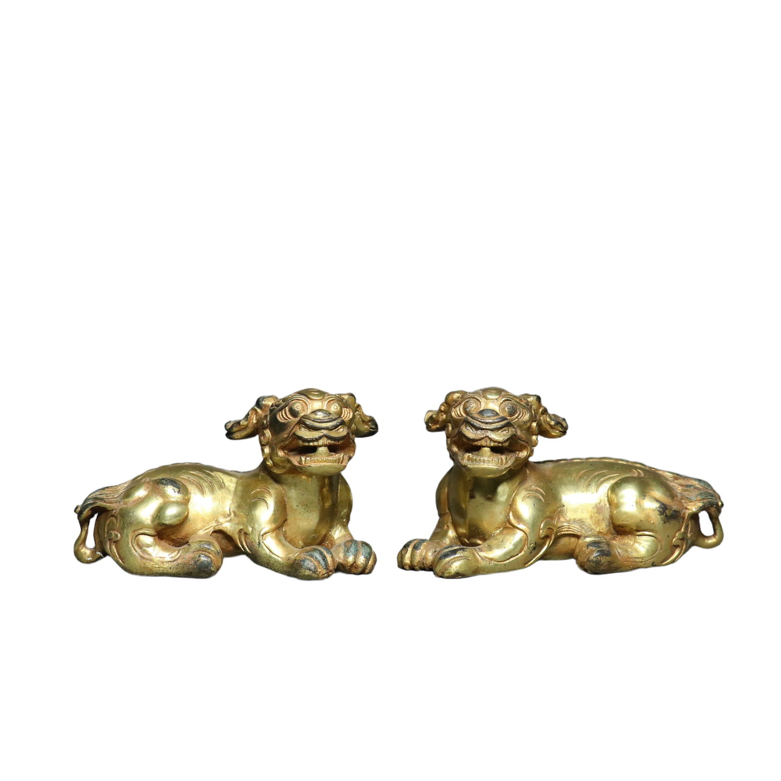 A pair of ancient bronze vessels with gilded auspicious beasts. (1 of 10)