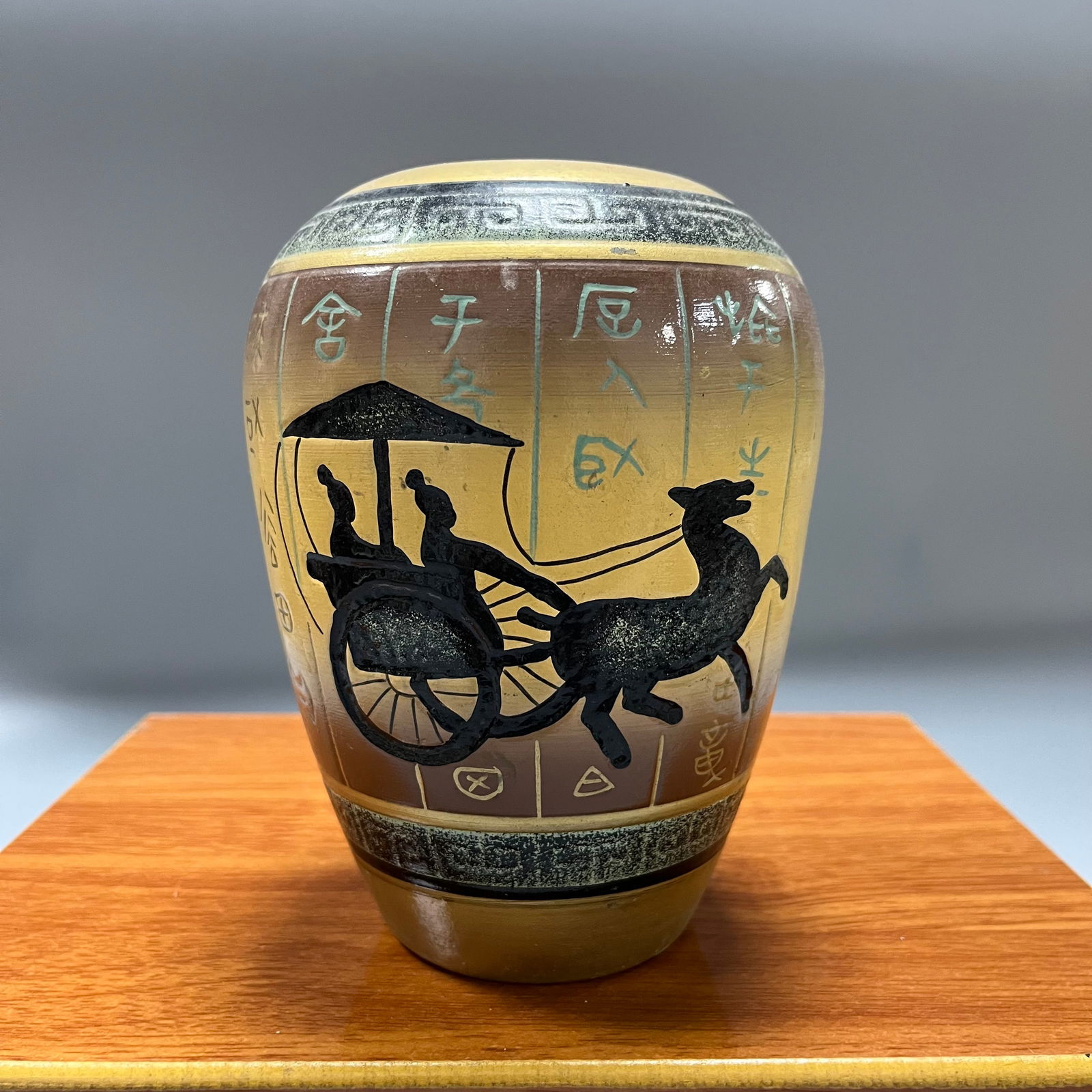 Pottery jar with chariot and horse design in bronze inscription (1 of 6)