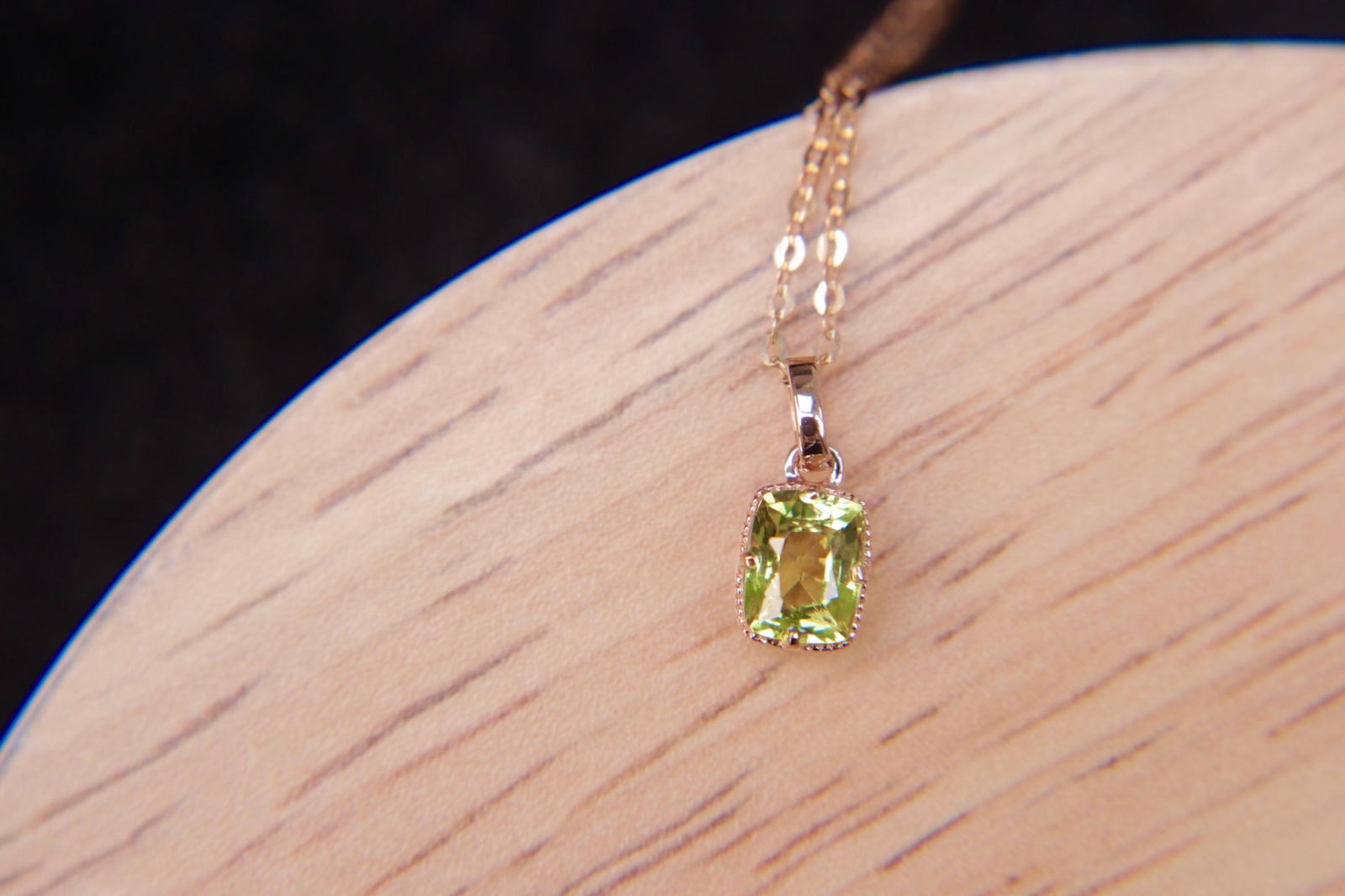 18K Gold Chrysoberyl Pendant: This 18K Gold Chrysoberyl Pendant exudes a sophisticated charm, making it a perfect choice for those who appreciate timeless elegance. The natural chrysoberyl, weighing 0.65 carats, is set in