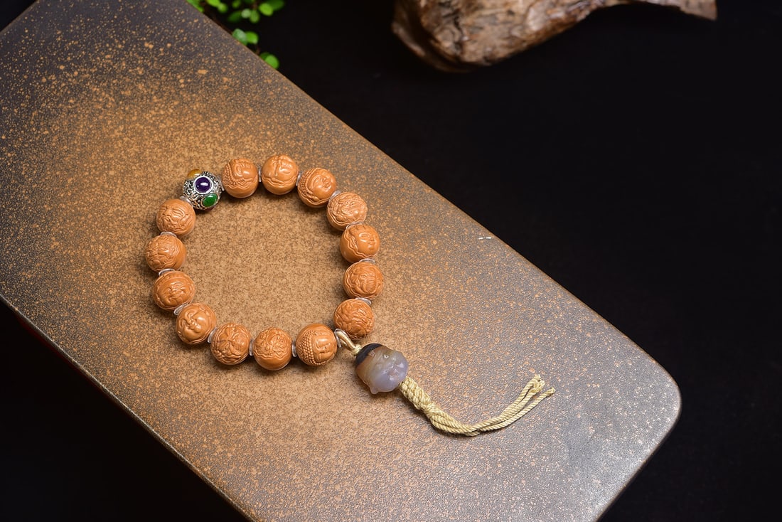 Natural Walnut Bead Bracelet: This exquisite bracelet showcases the artisanal beauty of natural walnut beads, each meticulously carved and selected for its superior quality. The beads are free from imperfections, offering a flawle