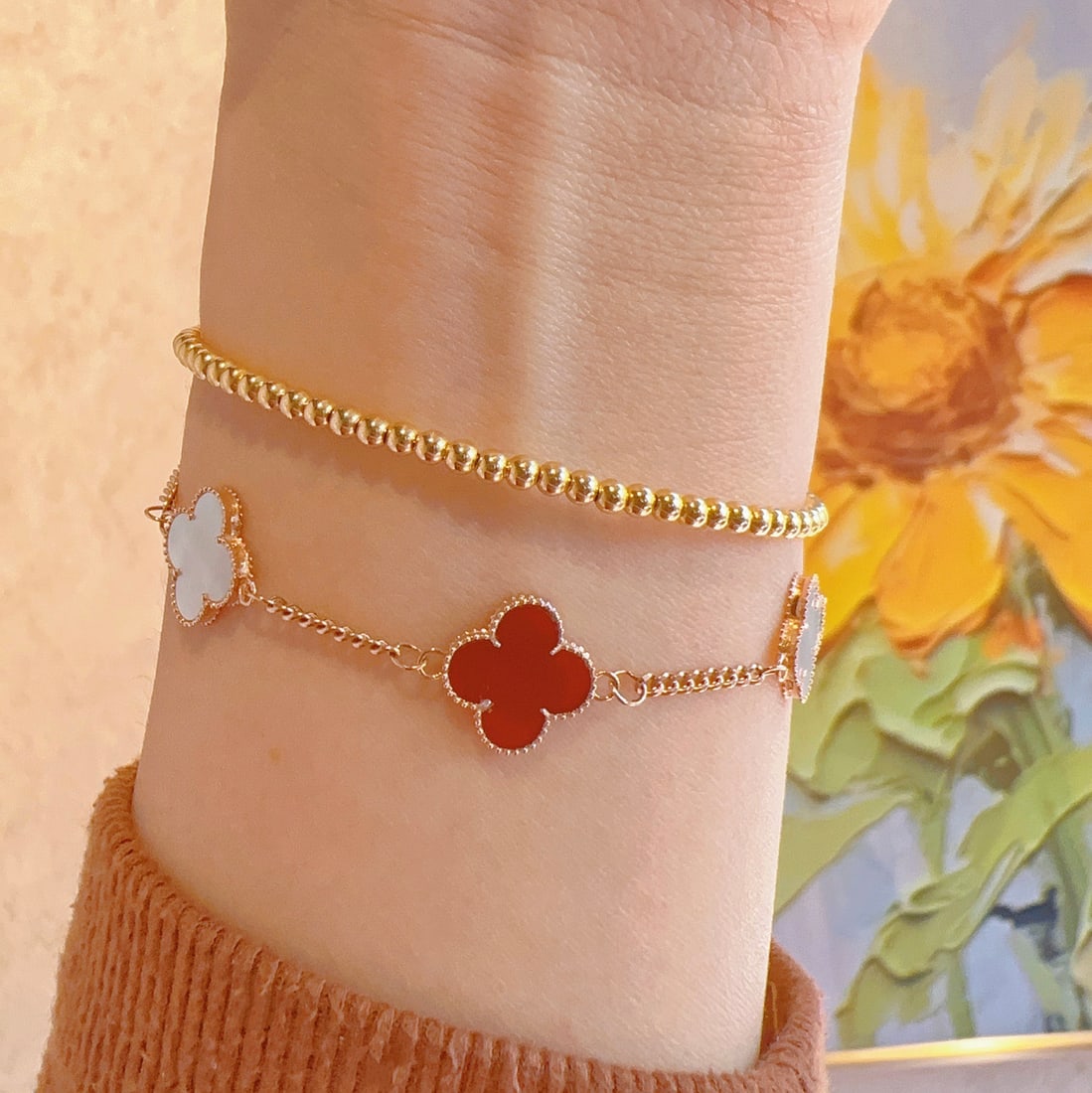 18K Gold Bracelet: This bracelet exudes an air of understated luxury, perfect for elevating your daily ensemble. Crafted from lustrous 18K gold, its classic design features a smooth bead finish that captures and