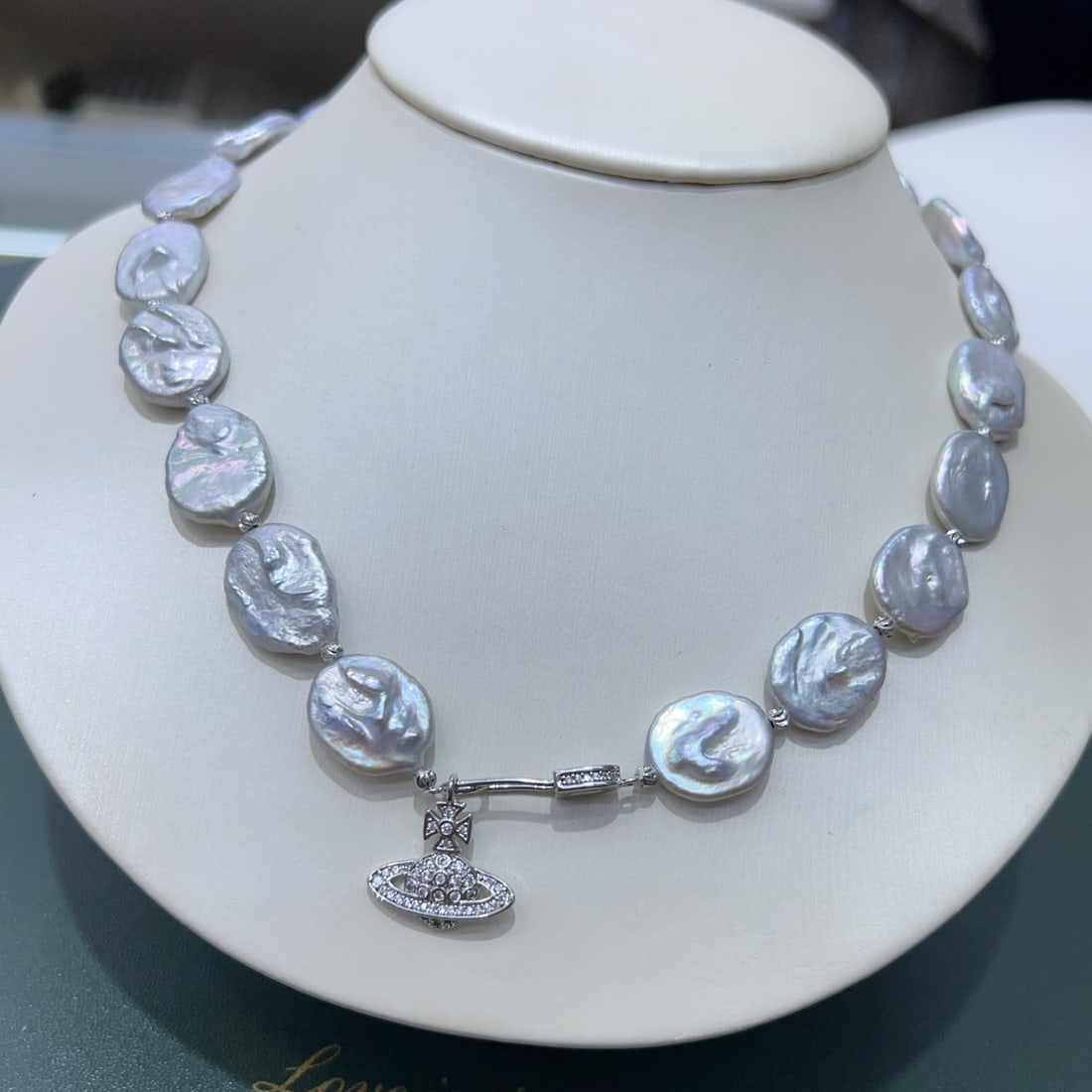 Baroque Pearl Necklace: This Baroque Pearl Necklace is a captivating blend of artistry and elegance, showcasing large, naturally formed pearls in a mesmerizing misty blue hue. Each pearl is hand-selected and crafted, embodyi