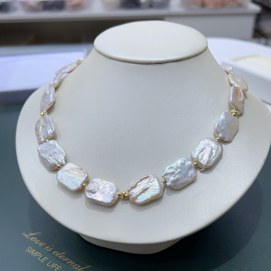 Natural Pearl Necklace: This pearl necklace captures the essence of baroque elegance with its large, natural pearls. Each piece is crafted with intricate handwork, making it an essential accessory for the fashion-forward ind