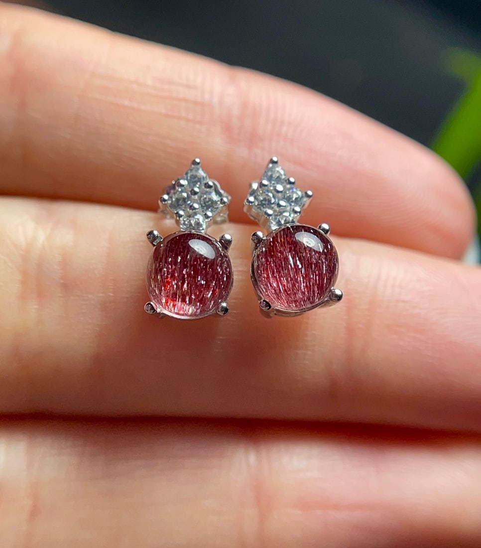 Natural Crystal Earrings: This pair of crystal earrings showcases the enchanting allure of natural crystals, renowned for their transparency and vivid color. Expertly set in sterling silver, these earrings are a testament to