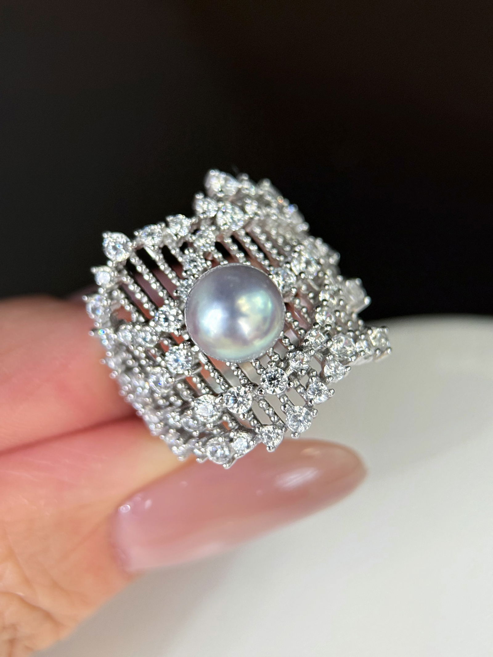 Silver Akoya Pearl Ring: This Silver Akoya Pearl Ring is a testament to refined elegance and modern luxury. The wide lace design exudes a sophisticated charm, capturing the essence of delicate craftsmanship. Perfectly embodyi