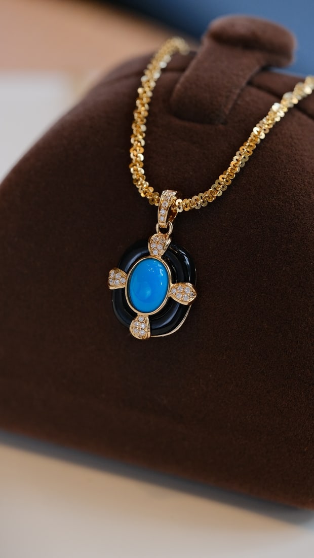 18K Gold Turquoise Pendant: This pendant captures the essence of timeless elegance with its high porcelain blue turquoise, reminiscent of a serene beauty in slumber. The exquisite design is enhanced by the regal vintage style,