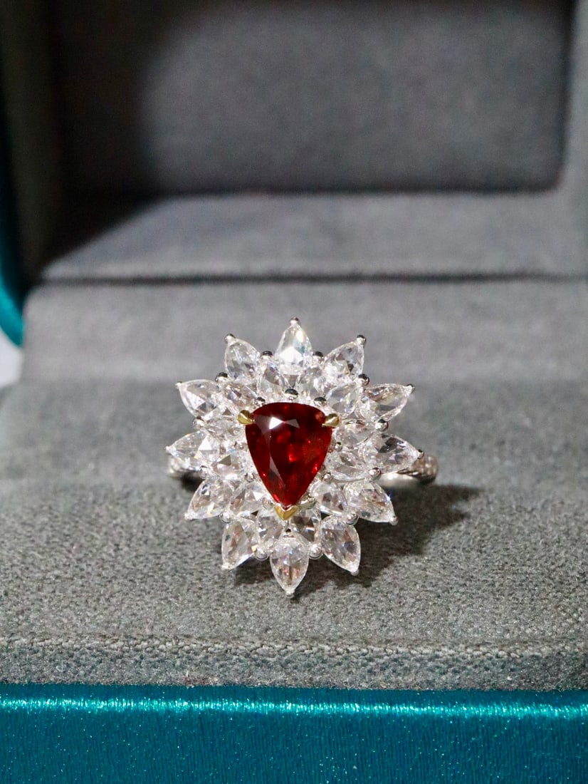 18K Gold Ruby Ring: This ruby ring captivates with its incredible beauty and the vivid, rich red hue of the ruby. It exudes a gentle yet luxurious charm, making it a must-have piece for the elegant and stylish woman.