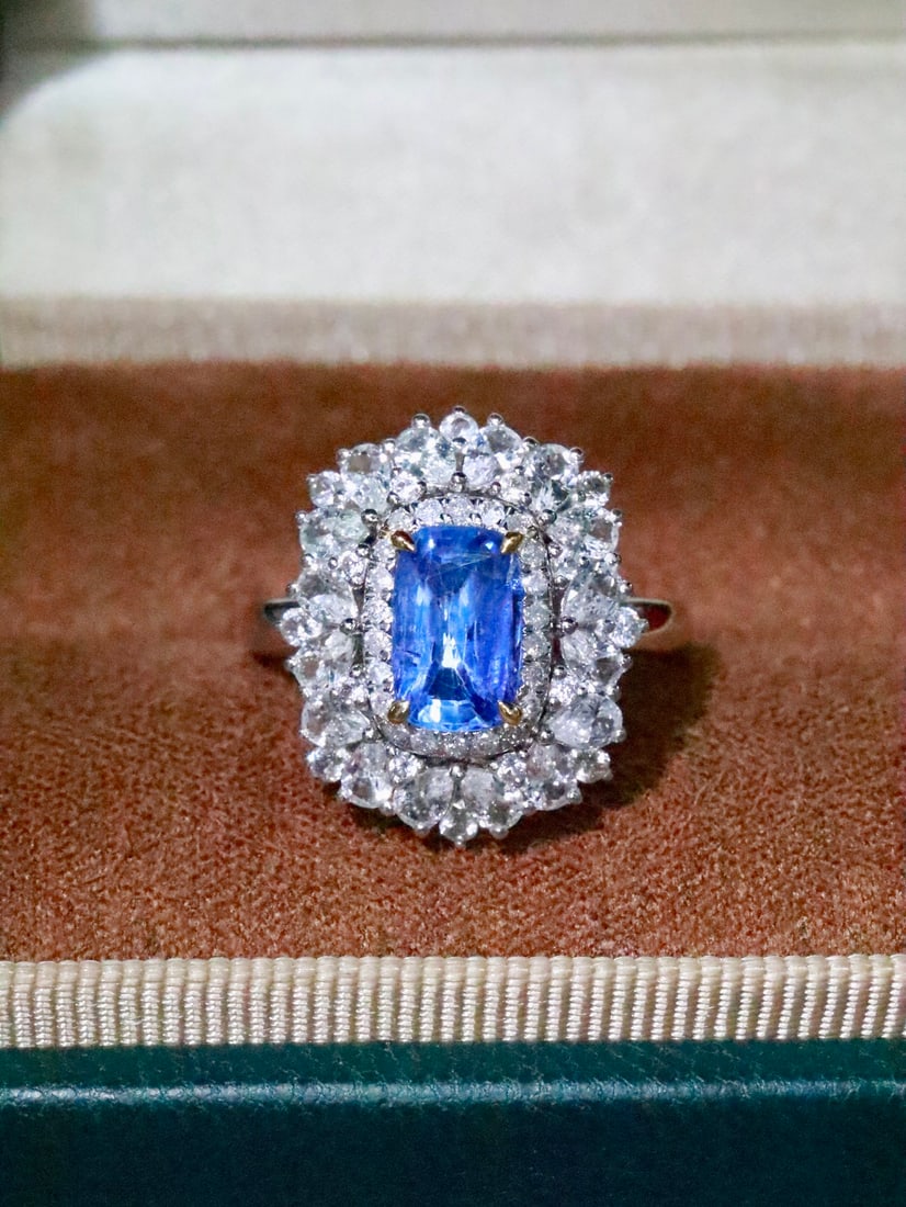 18K Gold Blue Sapphire Ring: This 18K Gold Blue Sapphire Ring captivates with the allure of a mesmerizing blue hue, reminiscent of a dazzling fairy sprite. The droplet-shaped sapphire, renowned for its vivid and rich color, is a