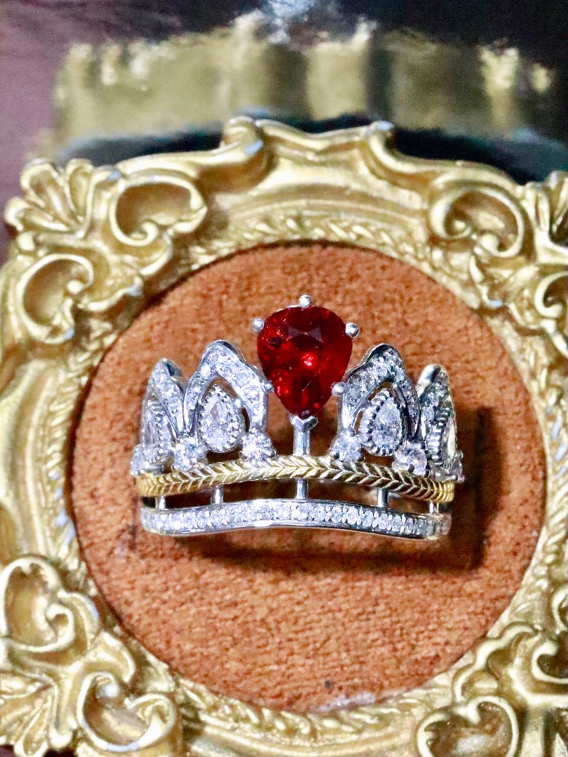 Platinum Ruby Ring: This platinum ruby ring captivates with its majestic allure, evoking the image of a noble princess. The unheated teardrop-shaped ruby is a mesmerizing sight, embodying a timeless elegance that never