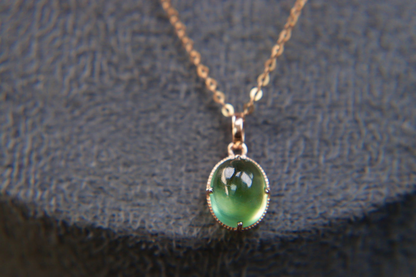 18K Gold Prasiolite Pendant: This exquisite 18K Gold Prasiolite Pendant embodies elegance and sophistication. The natural prasiolite, weighing 1.75 carats, radiates a serene green hue that complements the warmth of the 18K gold