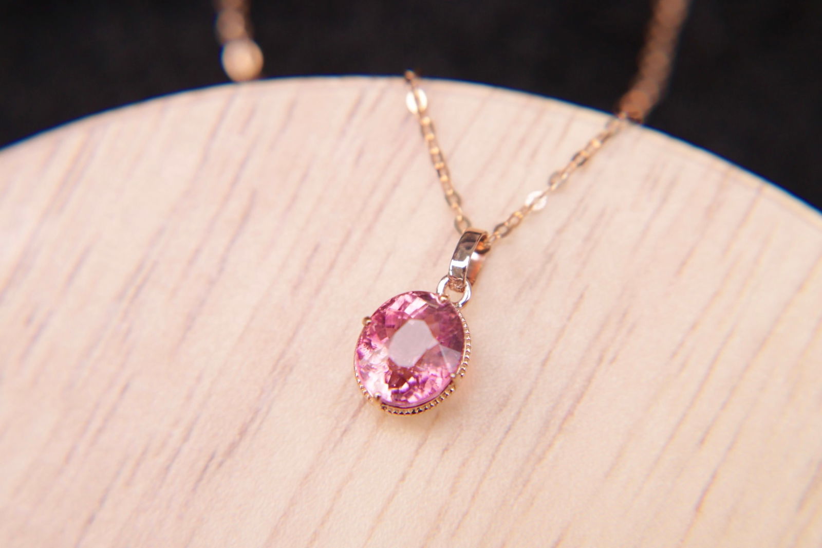 18K Gold Pink Tourmaline Pendant: This pendant captivates with its natural pink tourmaline, exuding a delicate charm that complements any ensemble. Crafted in 18K gold, the pendant showcases the vivid hue of the tourmaline, enhancing
