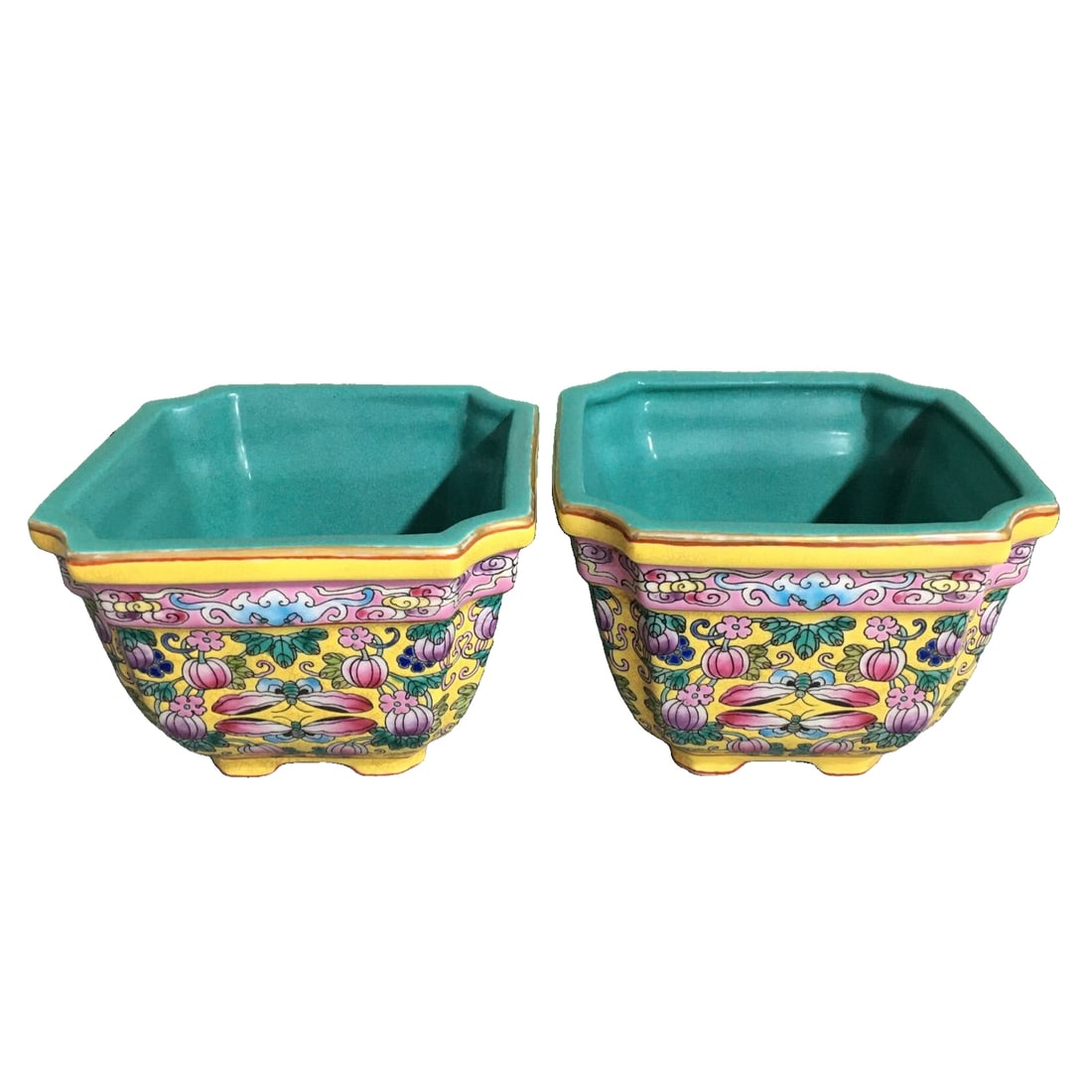 Qianlong Famille Rose Floral Square Cup: This square cup with enamel painted floral patterns from the Qianlong period of the Qing Dynasty features an elegant and square shape. The outer wall of the cup is decorated with pink enamel,