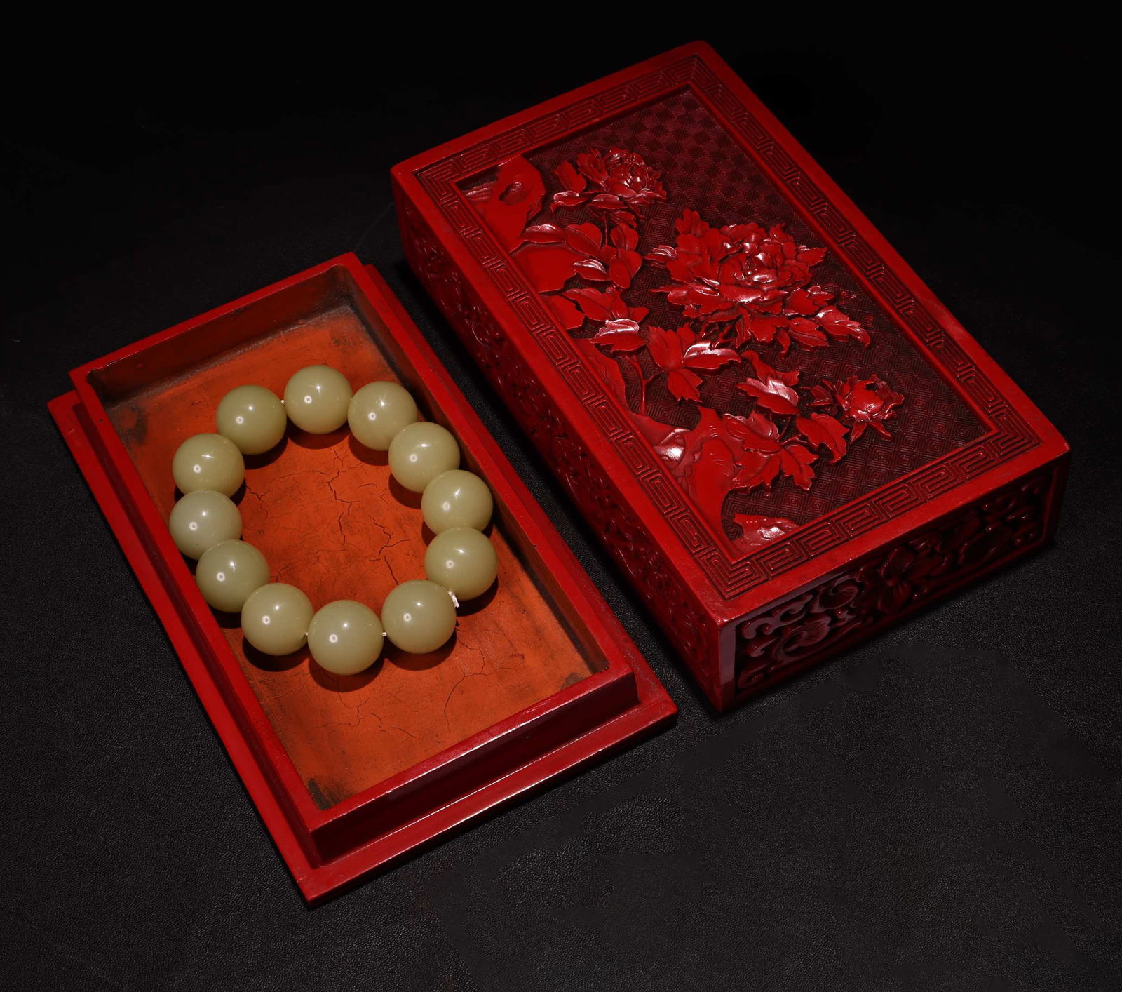 Embossed lacquerware box containing a jade bracelet. - 2
