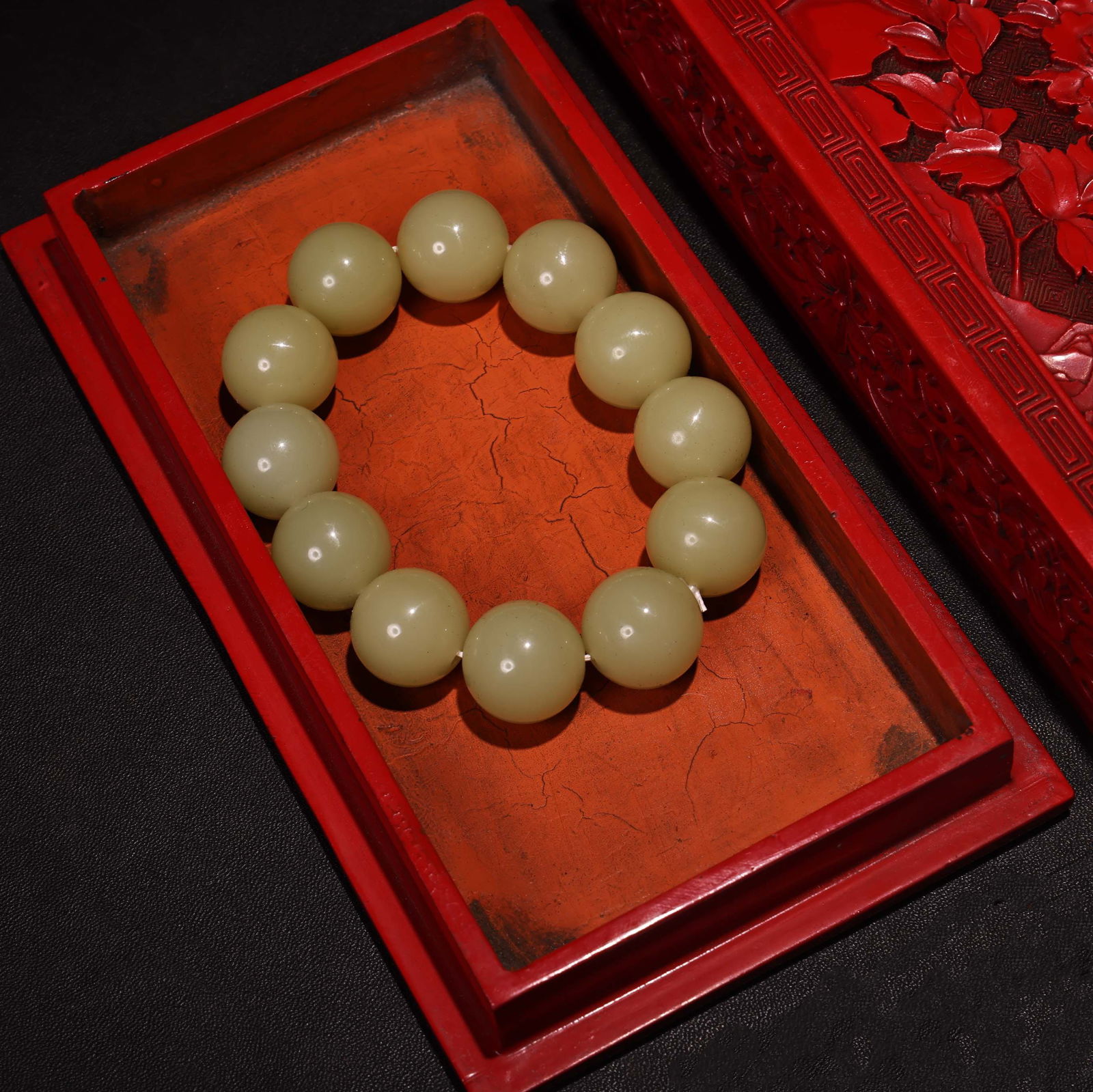 Embossed lacquerware box containing a jade bracelet. - 3