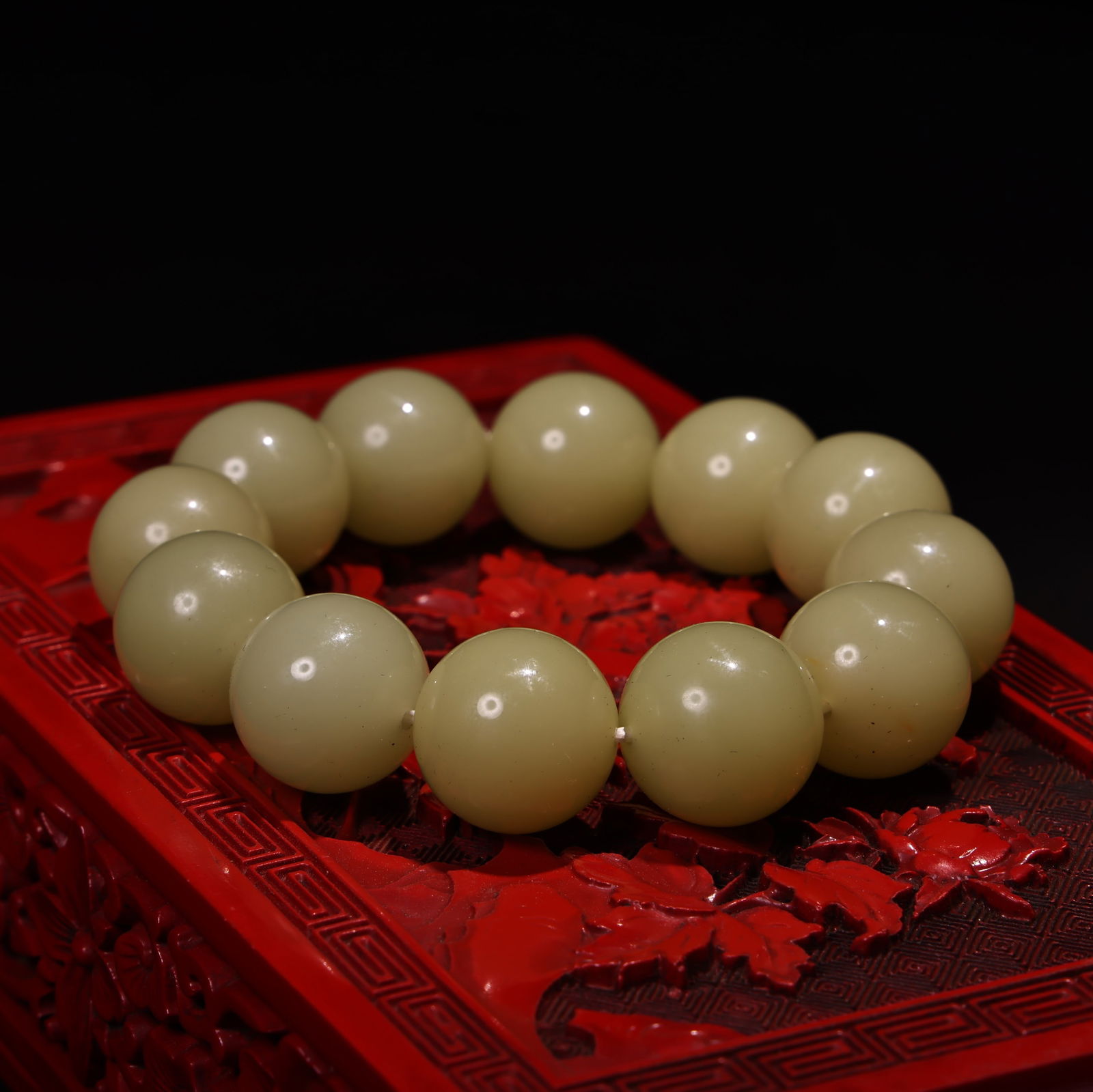 Embossed lacquerware box containing a jade bracelet. - 6