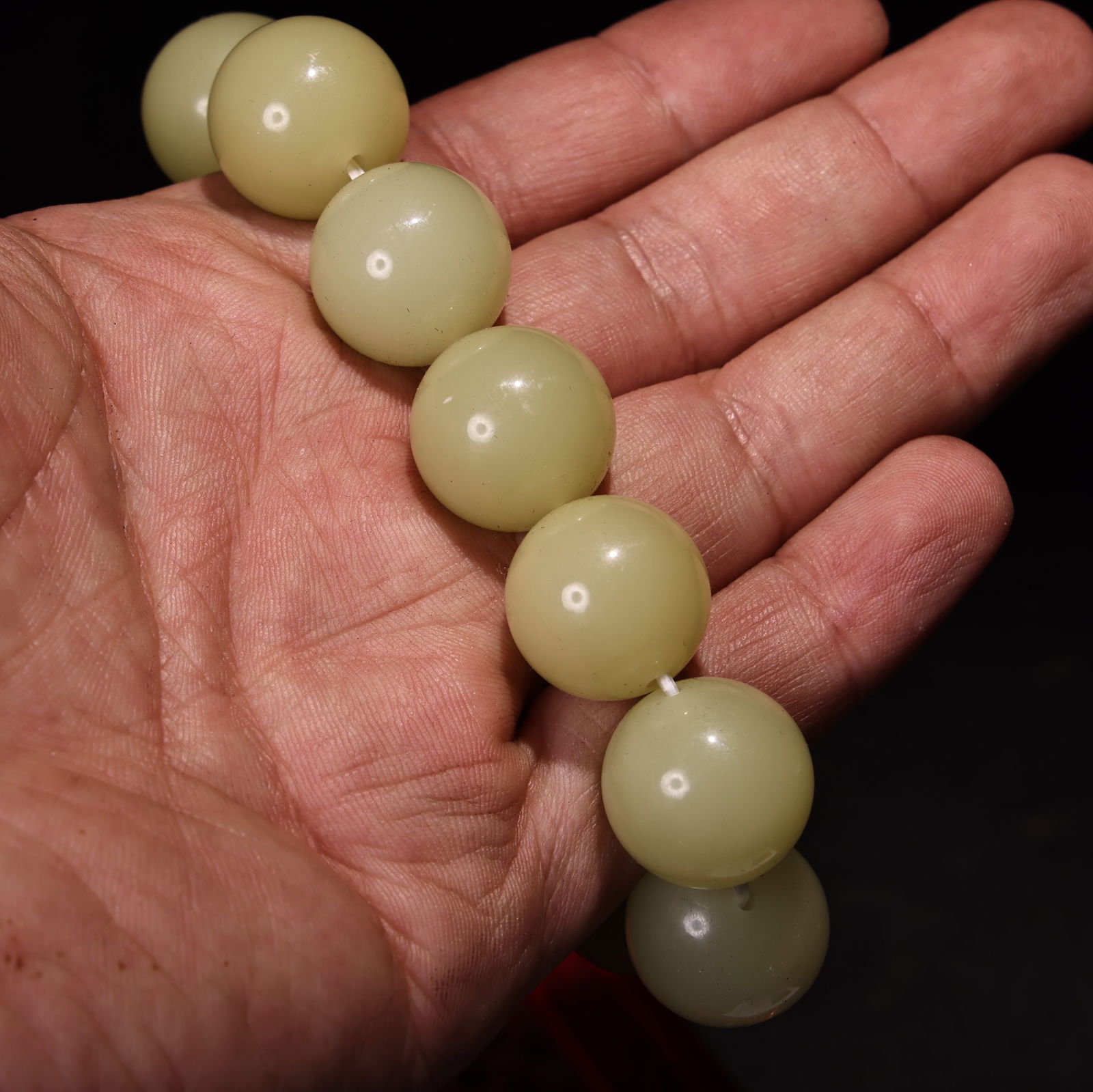 Embossed lacquerware box containing a jade bracelet. - 8